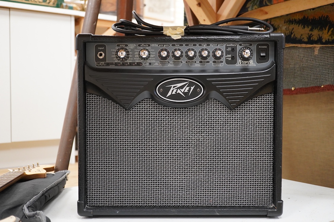 A Fender Squire electric guitar, with a Kinsman soft case, together with a Peavey VYPYR 15W modelling amplifier